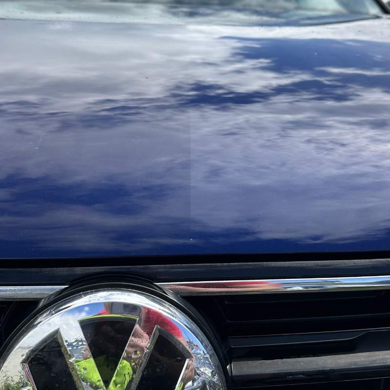 Ceramic coated dark car in sunlight — mobile detailing South Dublin